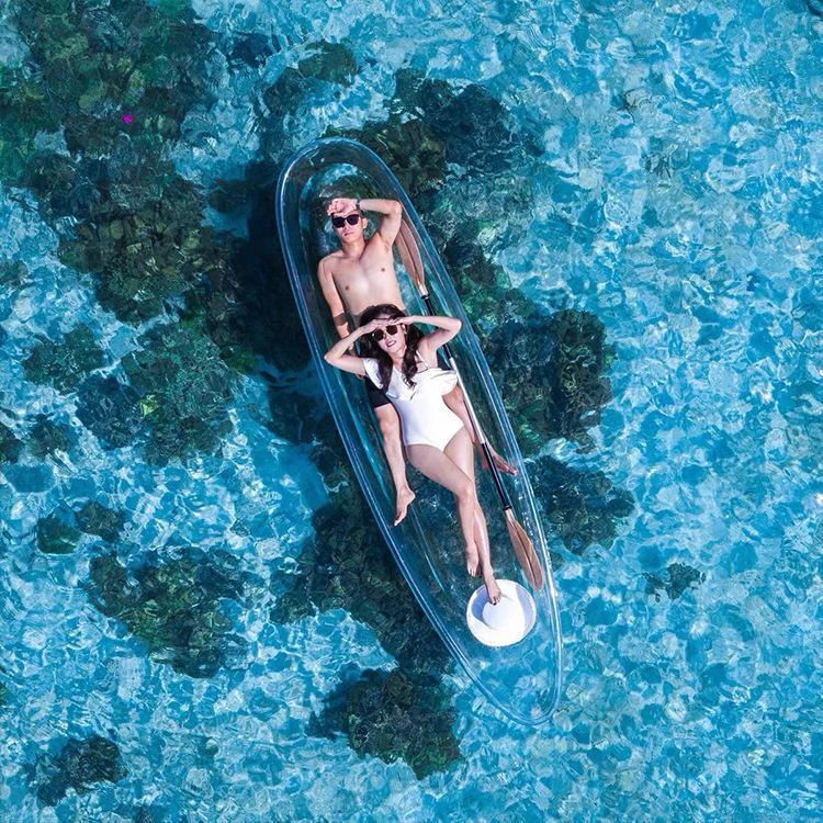 Couple enjoying a WOLANG transparent kayak in shallow turquoise water